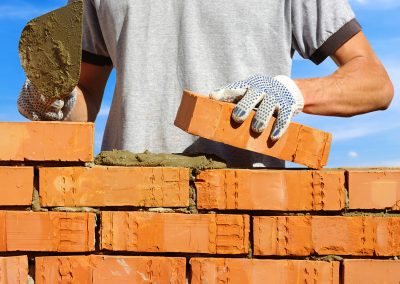 Worker laying bricks
